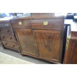 A 19th Century mahogany two door, two drawer side cabinet with oval brass handles, raised on bracket