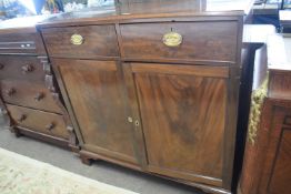 A 19th Century mahogany two door, two drawer side cabinet with oval brass handles, raised on bracket