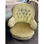 A Victorian button upholstered slipper type armchair on short turned legs with casters, 82cm high
