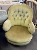 A Victorian button upholstered slipper type armchair on short turned legs with casters, 82cm high