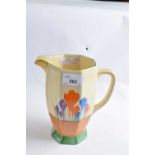 A Clarice Cliff tall jug of faceted form decorated with the crocus pattern