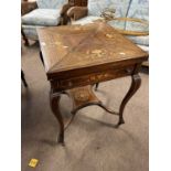 An Edwardian rosewood and inlaid envelope form card table with single drawer raised on cabriole legs