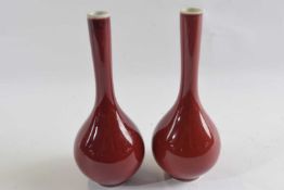 A pair of Chinese porcelain flambe teardrop vases with double concentric circle mark to base, 16cm