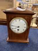 Early 20th Century mantel clock, white enamel dial with Roman numerals, the case with typical inlay