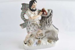 A Staffordshire group of Sampson and the Lion, 30cm high