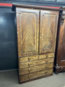 A 19th Century mahogany former linen press cabinet with moulded cornice over two panelled doors
