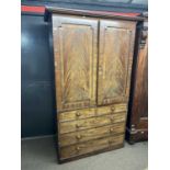 A 19th Century mahogany former linen press cabinet with moulded cornice over two panelled doors