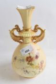 A Royal Worcester blush ground vase decorated with flowers, puce factory mark