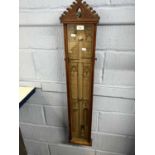 An Admiral Fitzroy barometer of typical form set in a gothic style case with carved pediment,