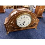 Art Nouveau style mantel clock with mother of pearl inlay raised on brass feet, manufactured by G