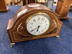 Art Nouveau style mantel clock with mother of pearl inlay raised on brass feet, manufactured by G
