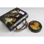 Japanese wooden purse modelled in relief with mother of pearl decoration together with a small