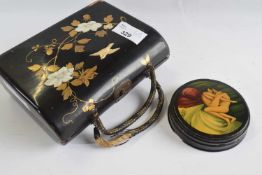 Japanese wooden purse modelled in relief with mother of pearl decoration together with a small
