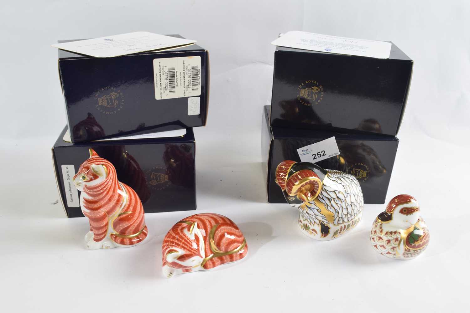 A group of four Royal Crown Derby paperweights with original boxes and certificates including