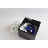 A Midnight Millenium paperweight by Caithness in original box and a further paperweight with white