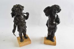 Two bronze figures of putti emblematic of harvest and one other both on rectangular marble bases,