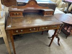 An Edwardian mahogany and inlaid writing table with an arched back with shelf and two small