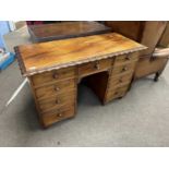 A 19th Century mahogany twin pedestal desk or dressing table with nine graduated drawers, the top