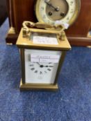 An early 20th Century brass carriage clock, the white enamel dial marked Dent, Pall Mall, London