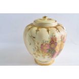 A Royal Worcester blush ground vase and cover of globular form painted with flowers