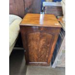 A Victorian mahogany collectors cabinet, the panelled door opening to an interior with twelve