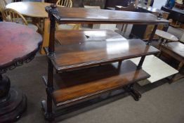 A 20th Century mahogany three tier buffet cabinet raised on turned side supports, 125cm wide