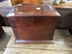 A mahogany humidor cabinet with hinged lid and full front opening to a partitioned top section and