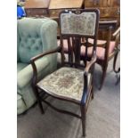 Edwardian mahogany framed and inlaid armchair with floral upholstery