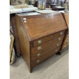 Georgian mahogany bureau with full front opening to a pigeon holed interior over a four drawer base,