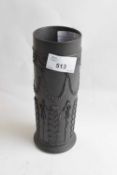 A Wedgwood black basalt vase of cylindrical shape decorated with classical swags and flowers