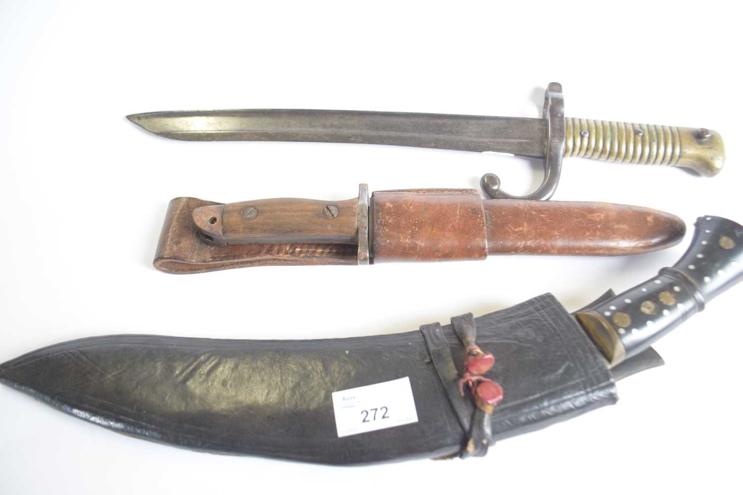 First World War bayonet stamped H5460 with other stamps, together with a Kukri knife in leather