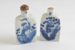 Two ceramic scent bottles with blue and white painted designgood condition lacking stopper to one