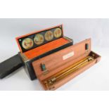 A boxed collection of lantern slides and measuring instrument marked G Thornton Ltd, Manchester,