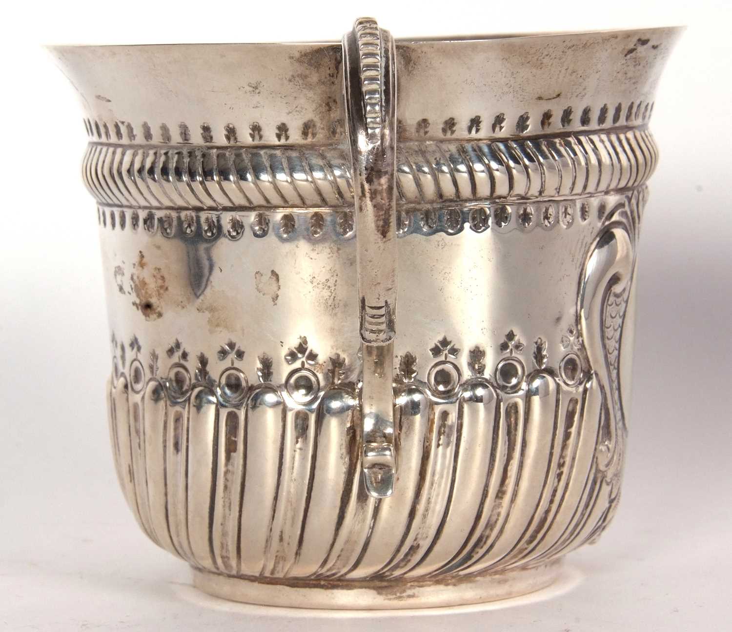 An early 20th Century copy of a George I loving cup, having two beaded scrolled handles, wrythen - Image 7 of 36