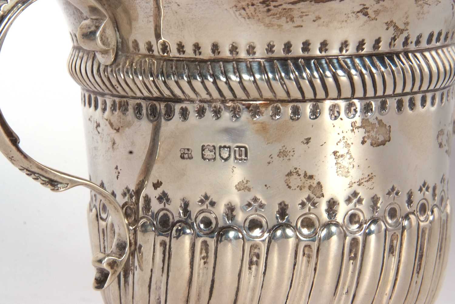 An early 20th Century copy of a George I loving cup, having two beaded scrolled handles, wrythen - Image 6 of 36