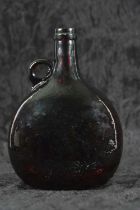 Late 17th or early 18th Century amber glass wine bottle