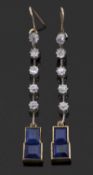 Sapphire and diamond pendant earrings, set with two graduated princess cut sapphires, calibre set