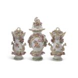 Garniture of Chelsea Gold Anchor pot pourri vases and covers with Rococo type moulding and painted