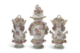 Garniture of Chelsea Gold Anchor pot pourri vases and covers with Rococo type moulding and painted
