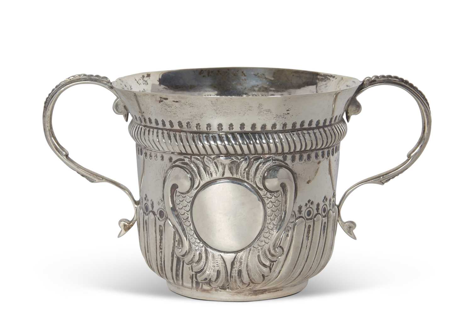 An early 20th Century copy of a George I loving cup, having two beaded scrolled handles, wrythen - Image 10 of 36