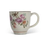 Lowestoft coffee cup circa 1770 decorated with flowers by the tulip painter within a brown line rim