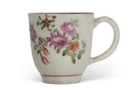 Lowestoft coffee cup circa 1770 decorated with flowers by the tulip painter within a brown line rim