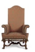 A William and Mary style walnut framed large armchair with damask covering, 122cm high, 75cm wide,