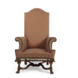 A William and Mary style walnut framed large armchair with damask covering, 122cm high, 75cm wide,