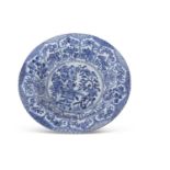 A large Chinese porcelain dish with a blue and white painted Ming style design, Qing Dynasty, six