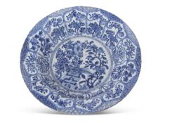 A large Chinese porcelain dish with a blue and white painted Ming style design, Qing Dynasty, six