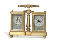 A reproduction gilt metal and enamelled panelled carriage clock/barometer combination with central