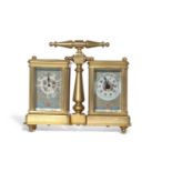 A reproduction gilt metal and enamelled panelled carriage clock/barometer combination with central