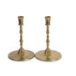 A pair of large Flemish brass candlesticks with knopped stems and spreading circular bases reputedly