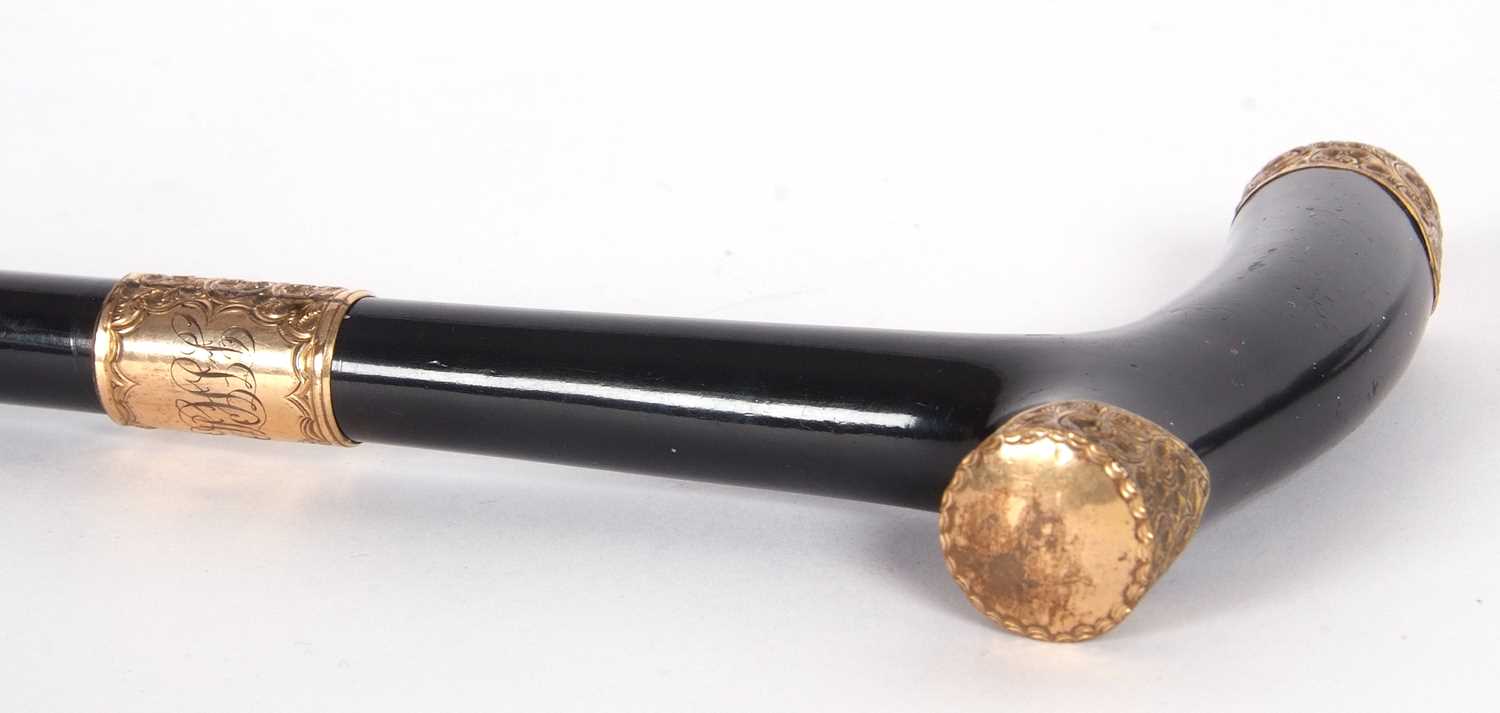 A late 19th Century ebonised walking cane/stick with foliate engraved 18ct gold mounts (each mount - Image 7 of 8